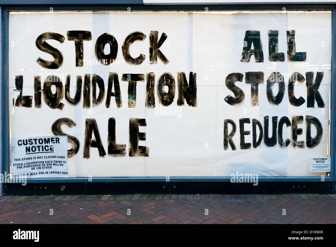 Shop window notice Stock Liquidation Sale All Stock Reduced. Small