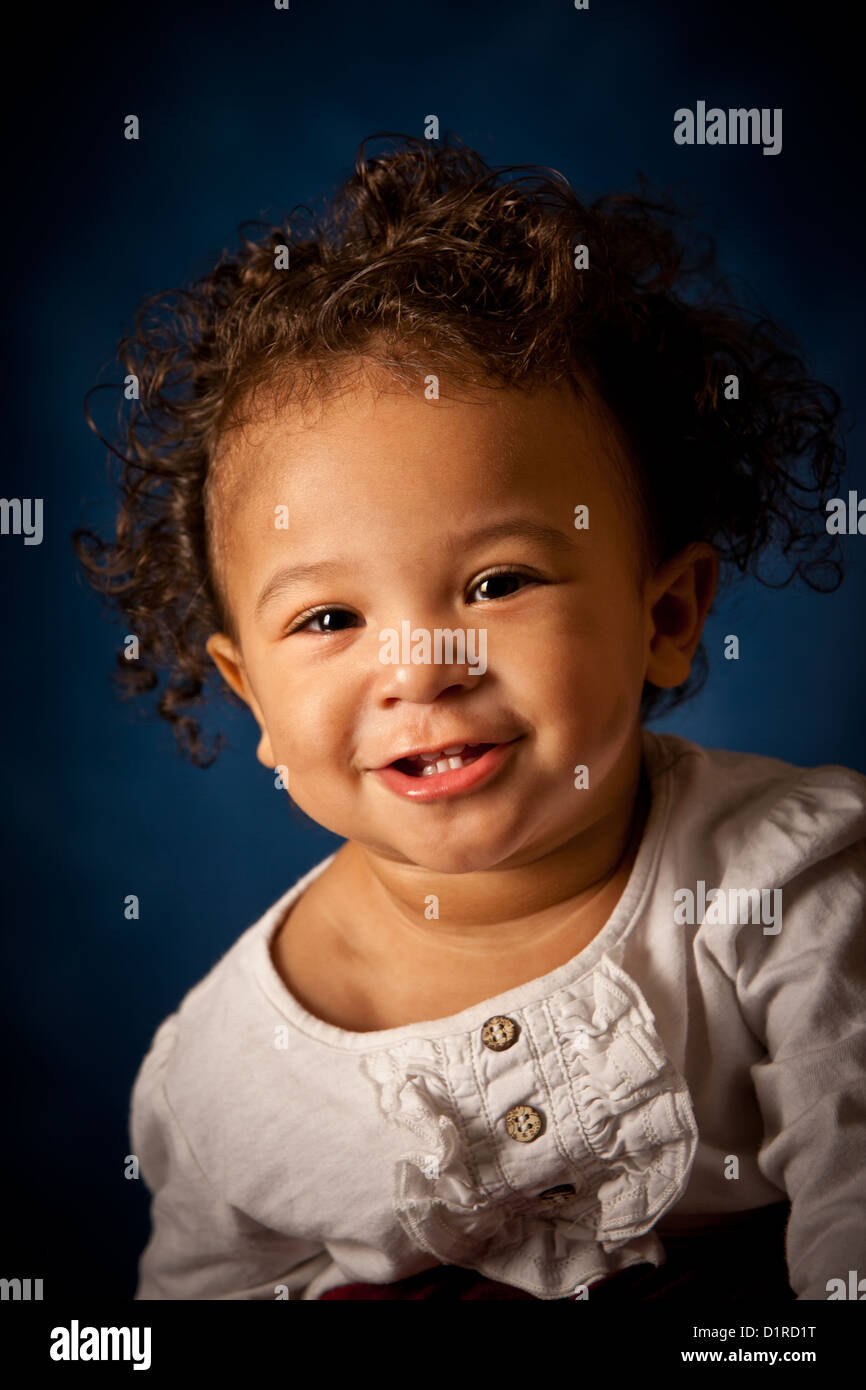 Studio portrait of a cute baby girl, 18 months, mixed race Stock Photo -  Alamy