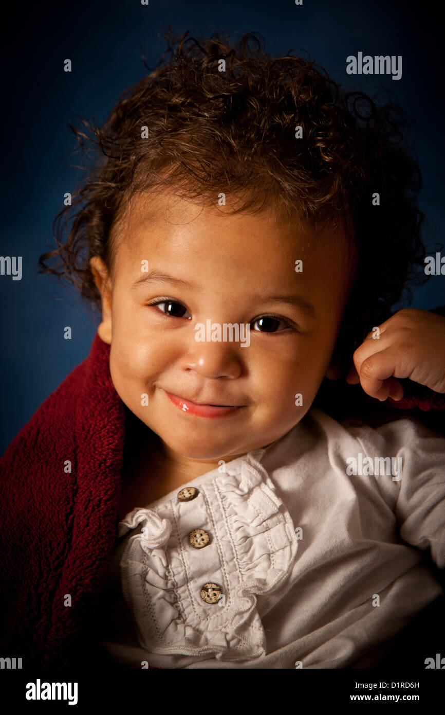 Studio Portrait Of A Cute Baby Girl 18 Months Mixed Race Stock