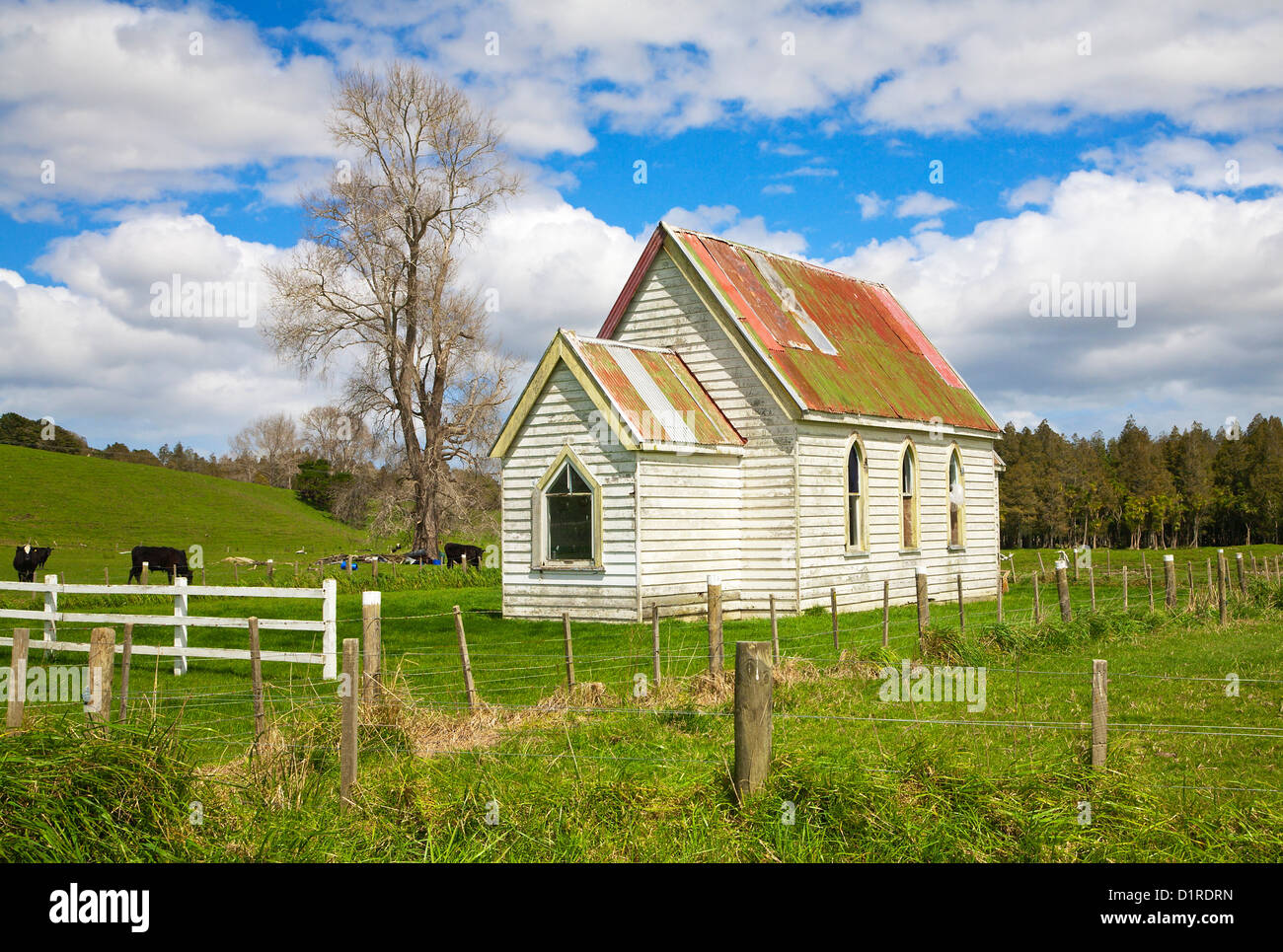 a view of an old abandoned wooden church with a corrugated metal pitched roof, North Island, New Zealand. Stock Photo