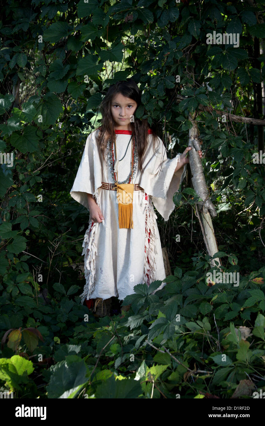 A young Native American Indian girl in the woods Stock Photo
