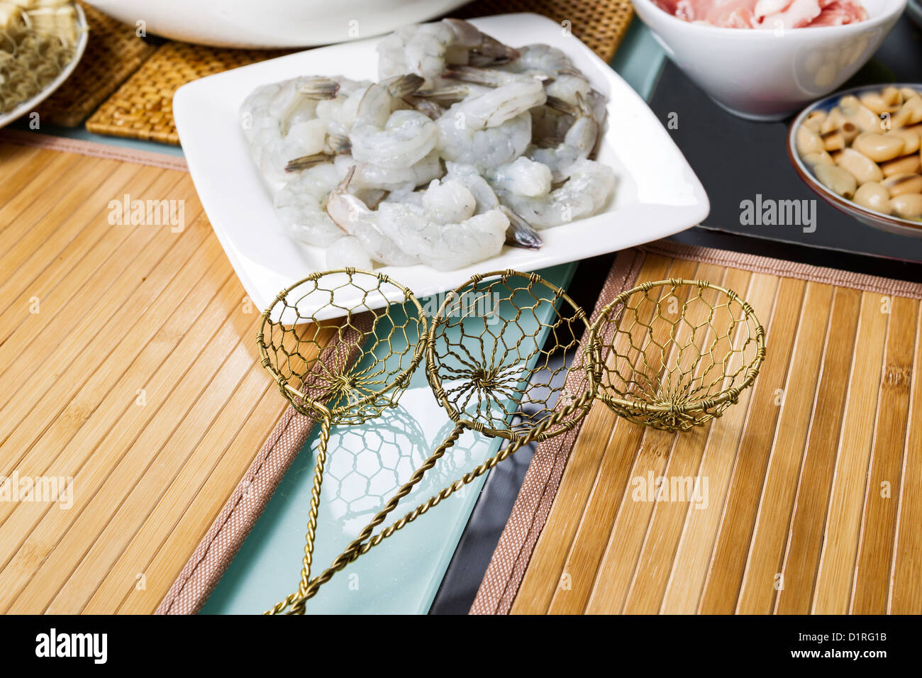 Three wire brass food strainers for hot pot meal use Stock Photo