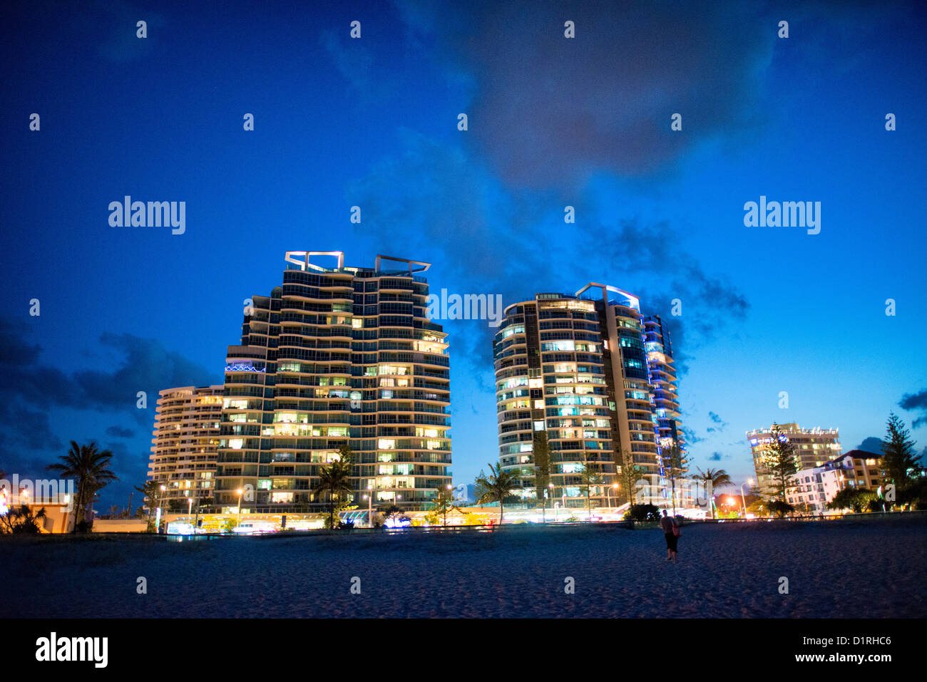 Holiday unit buildings on Coolangatta's skyline at dusk. Sometimes paired as 'Twin Towns,' Coolangatta and Tweed Heads, on the southern end of the Gold Coast, straddle the Queensland-New South Wales border. Stock Photo