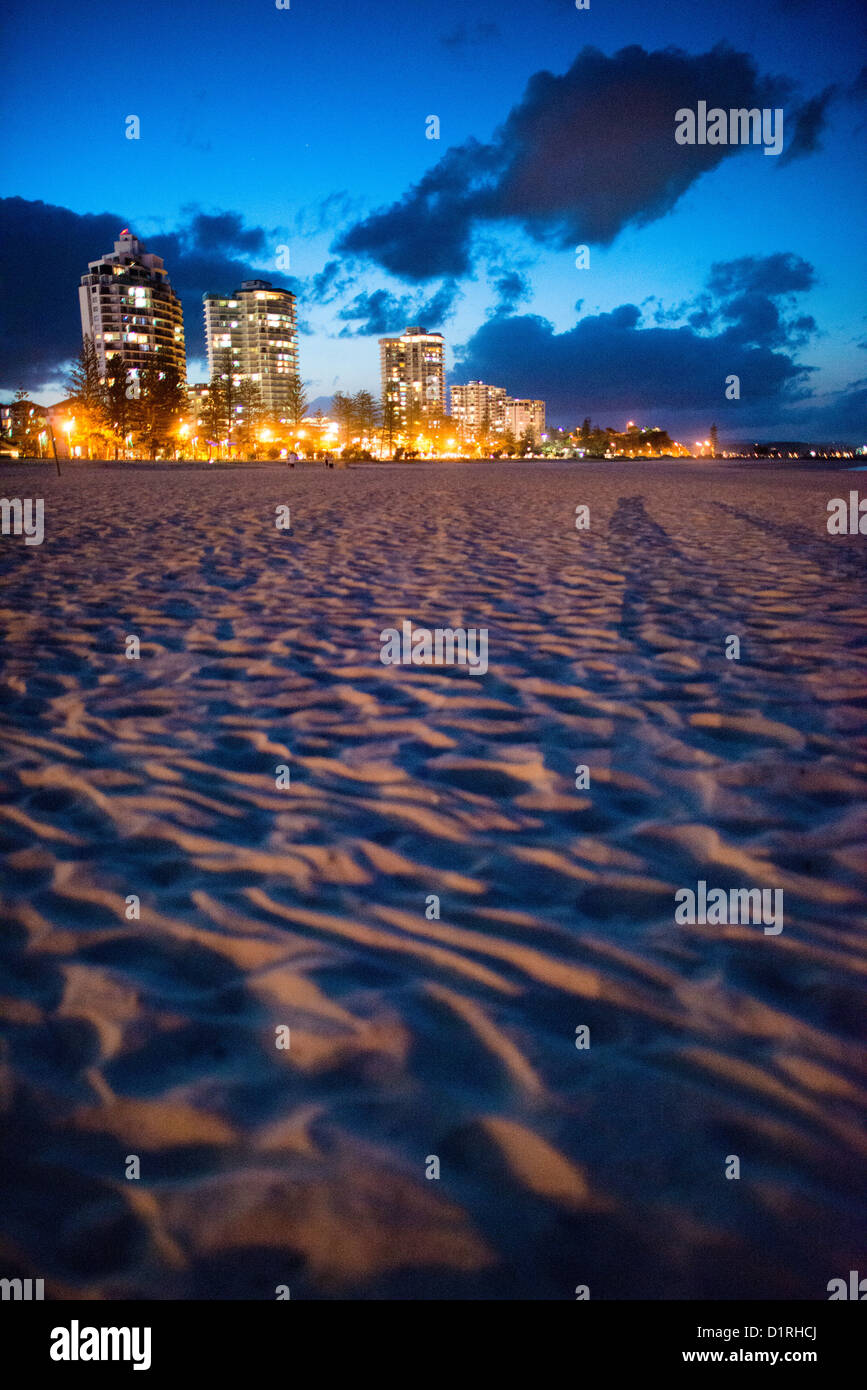 Coolangatta's beach and skyline at dusk. Sometimes paired as 'Twin Towns,' Coolangatta and Tweed Heads, on the southern end of the Gold Coast, straddle the Queensland-New South Wales border. Stock Photo