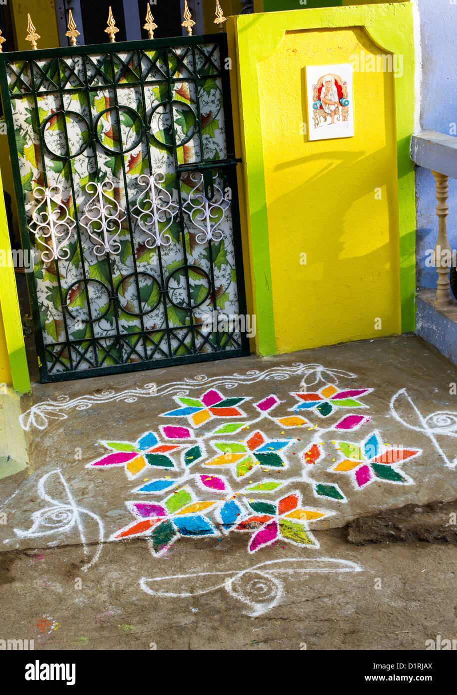 Rangoli coloured powder design in an Indian street during the sankranthi festival. Andhra Pradesh, India Stock Photo