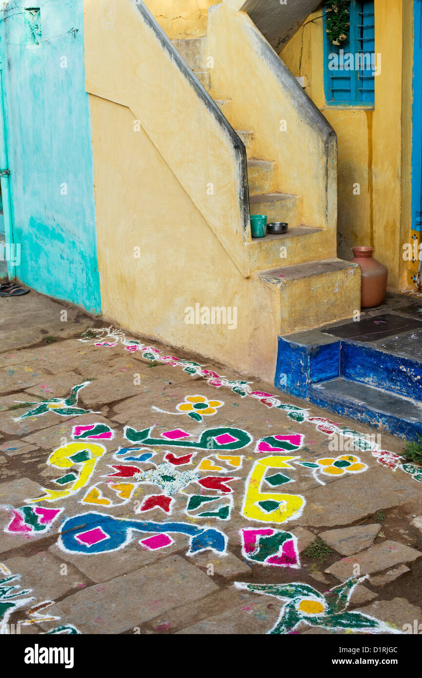 Rangoli coloured powder design in an Indian street during the sankranthi festival. Andhra Pradesh, India Stock Photo