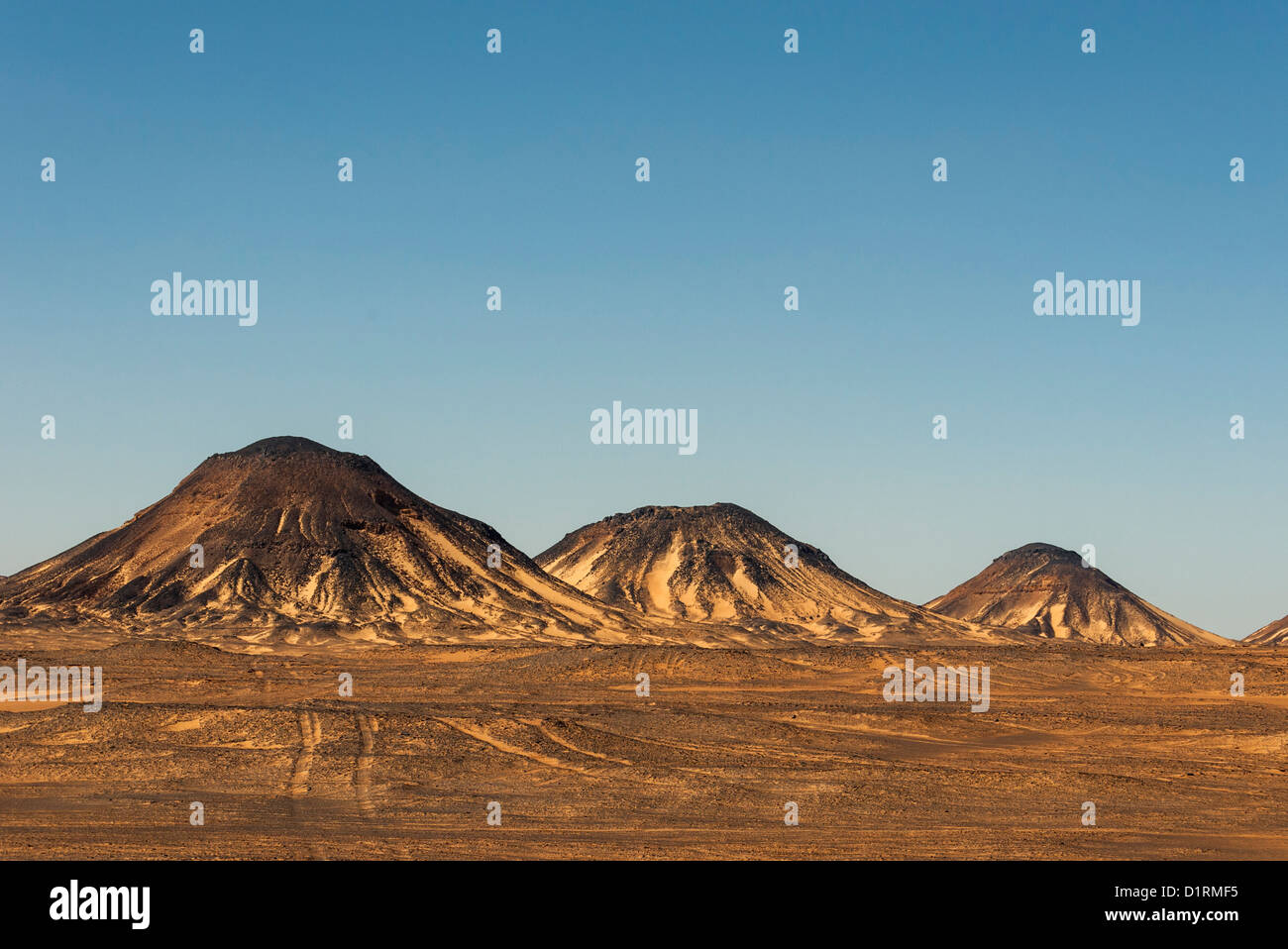 Volcano-shaped Mountains of Black Desert, Egypt Stock Photo