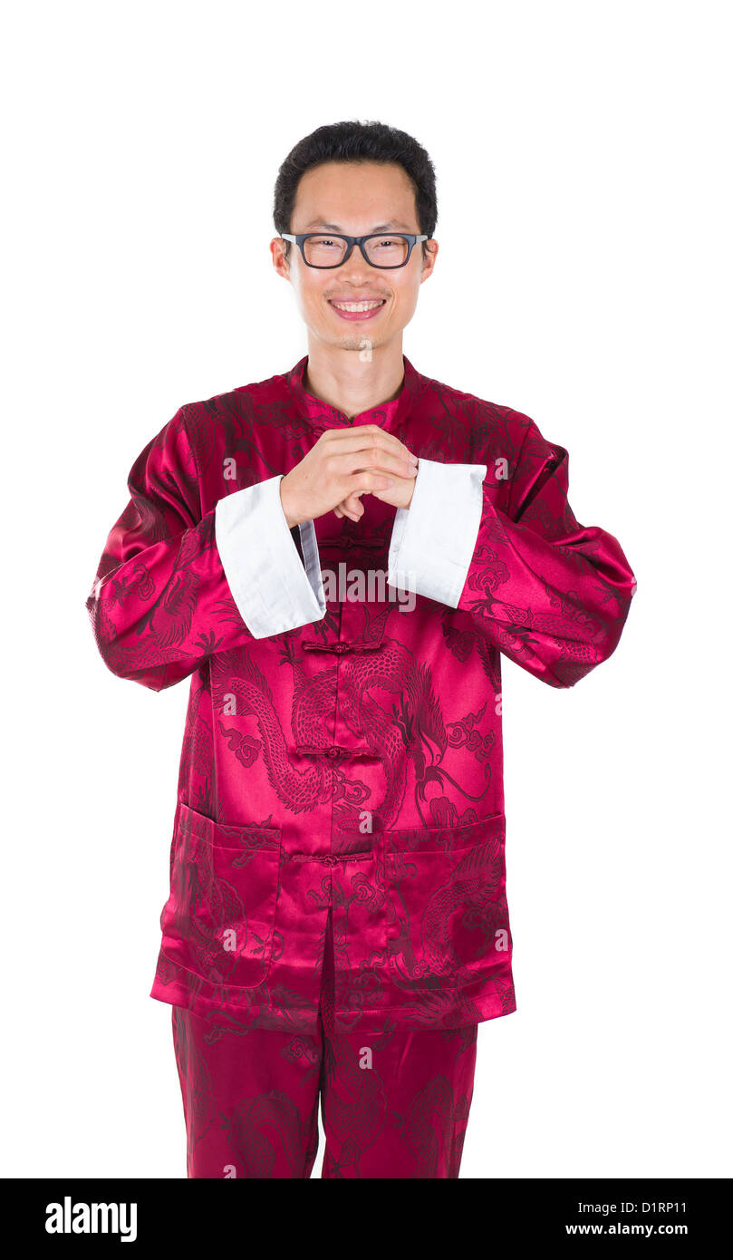 chinese man in traditional suit in chinese greeted isolated in white Stock Photo