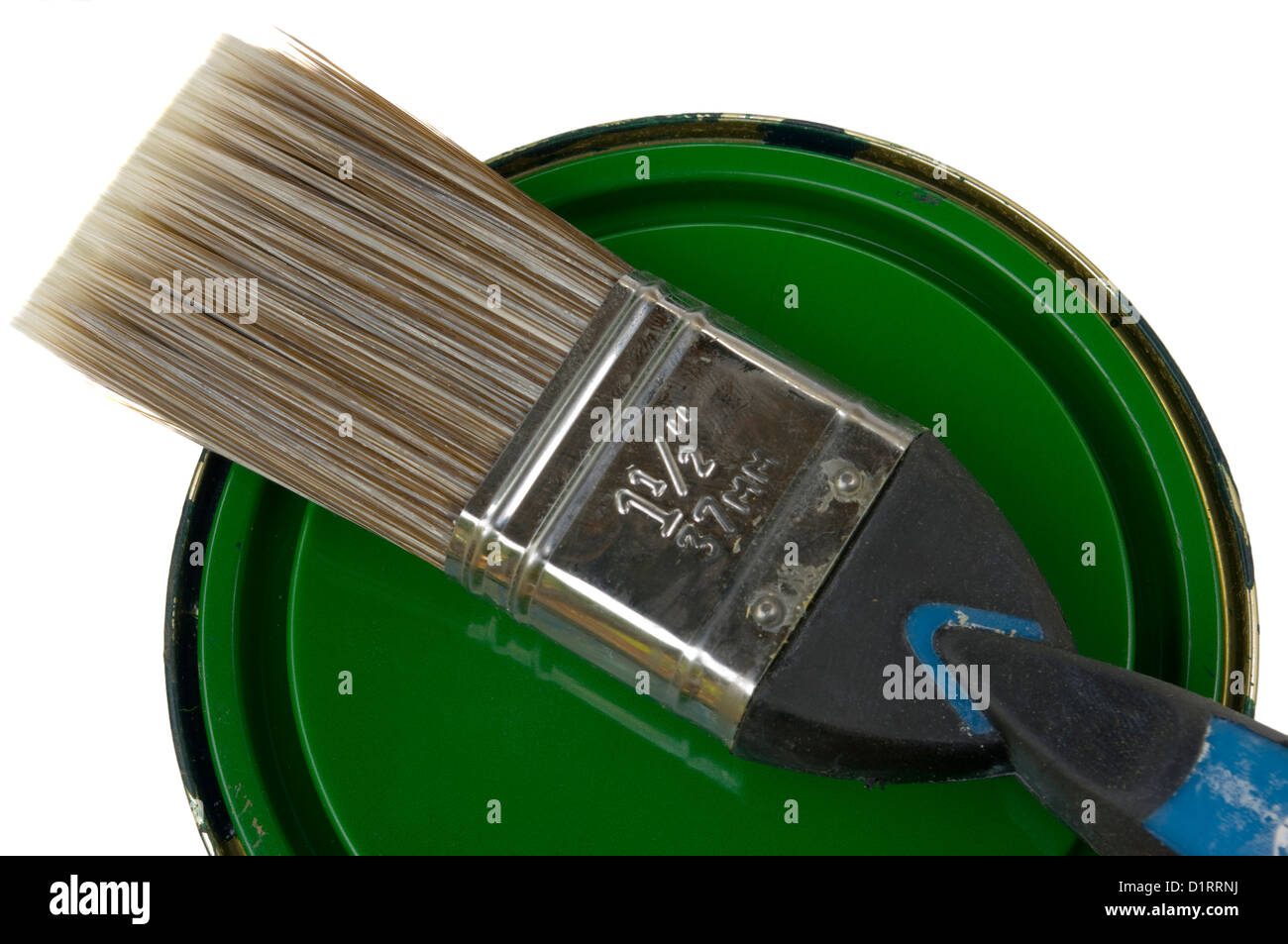 Paint Brush On a Tin Of Green Paint Stock Photo