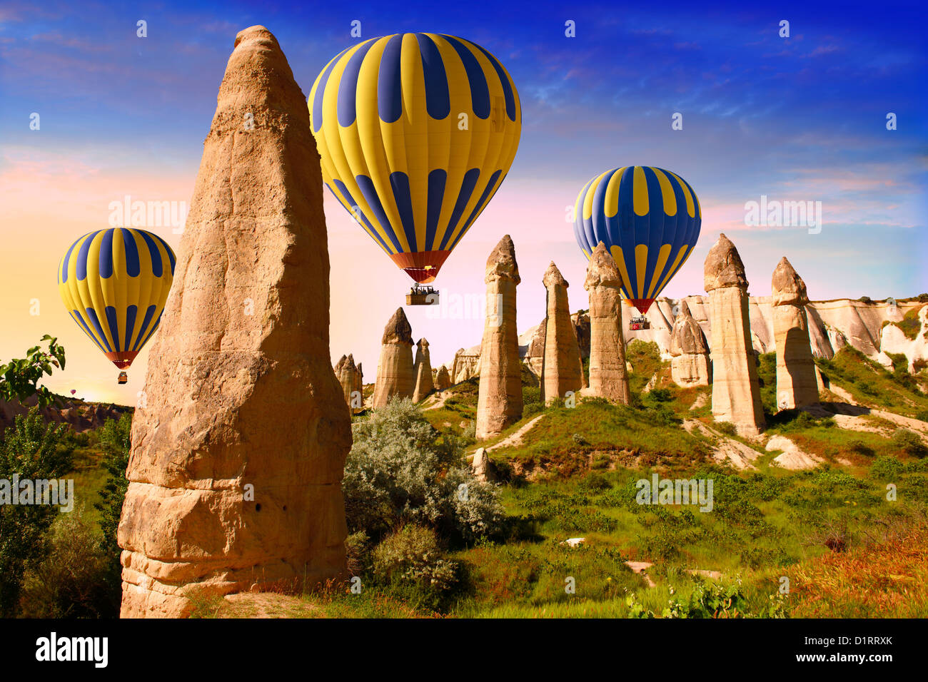 Hot Air Balloons over the Fairy Chimneys in Love Valley at sunrise near ...