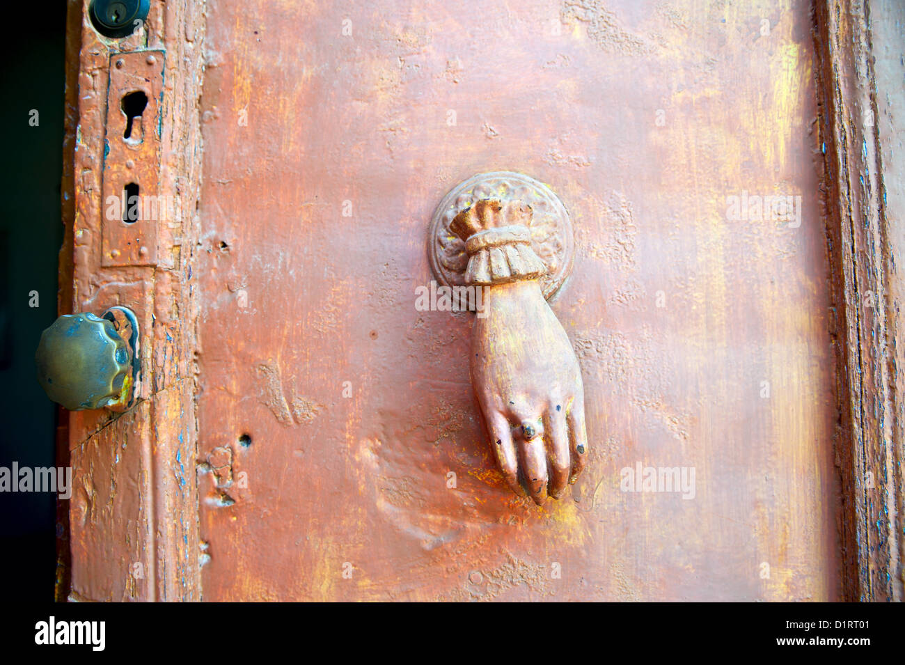 Hand female brass knock knocker hi-res stock photography and images - Alamy