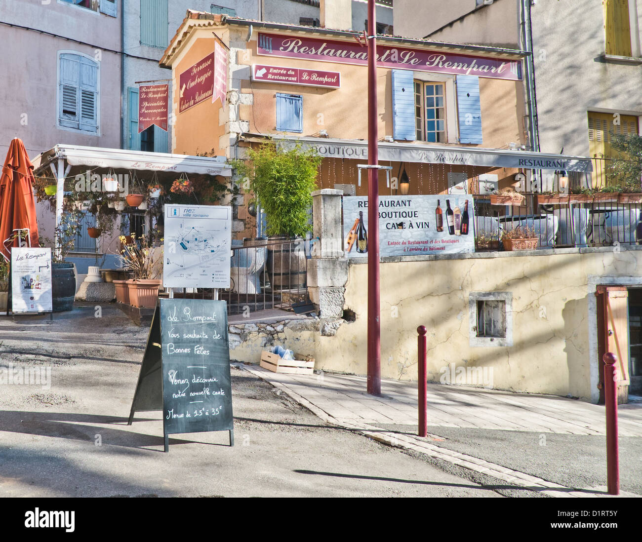 A street scene of Restaurant le Rempart in the small Roman village of Riez in France. Stock Photo