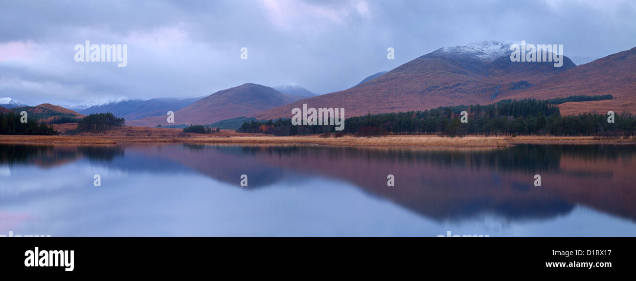 Loch Tulla Scotland panorama, reflections of the distant mountains in the Loch. Stock Photo