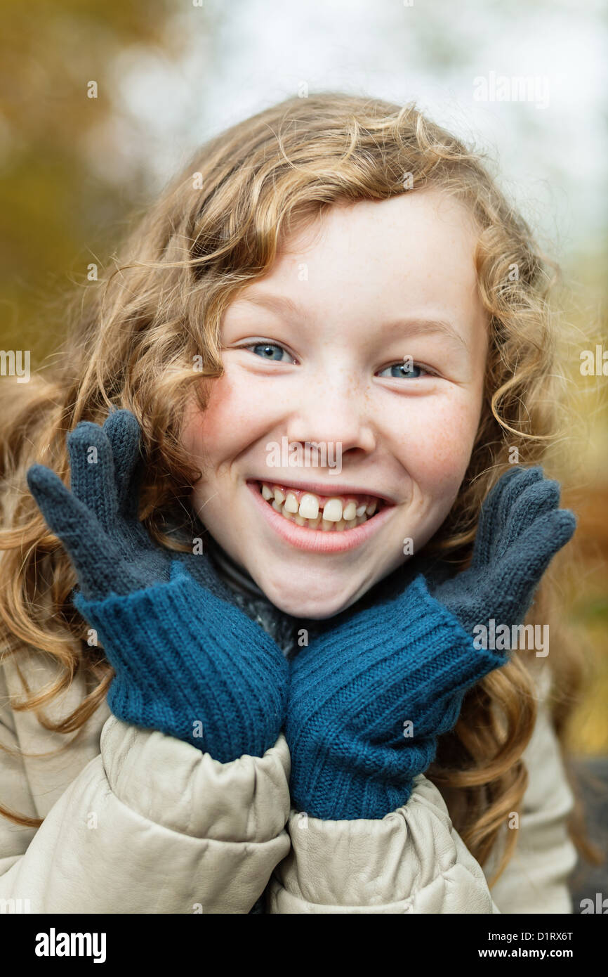 Outdoor portrait of smiling blond girl in autumn park Stock Photo - Alamy