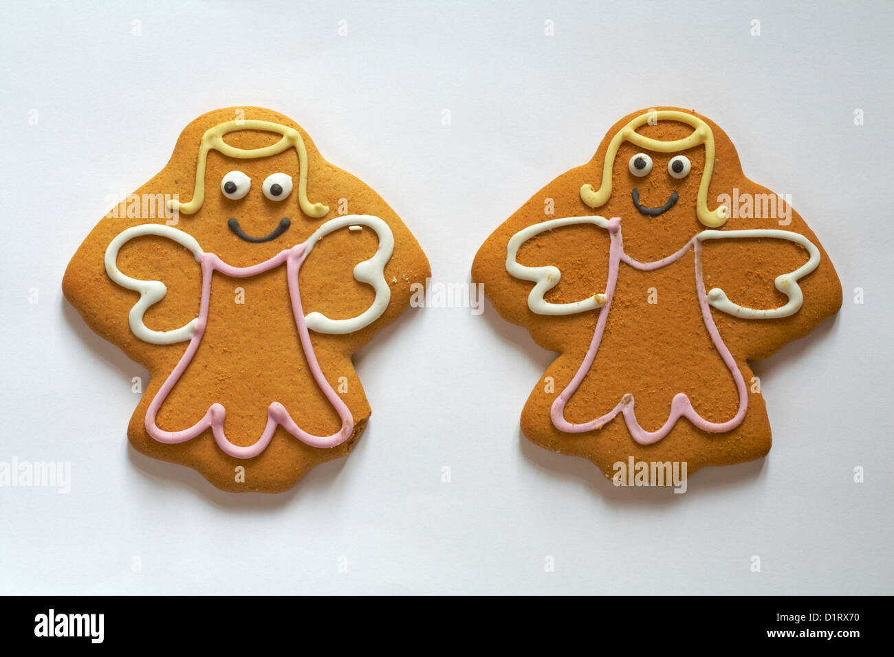 Two angel gingerbread biscuits cookies set on white background