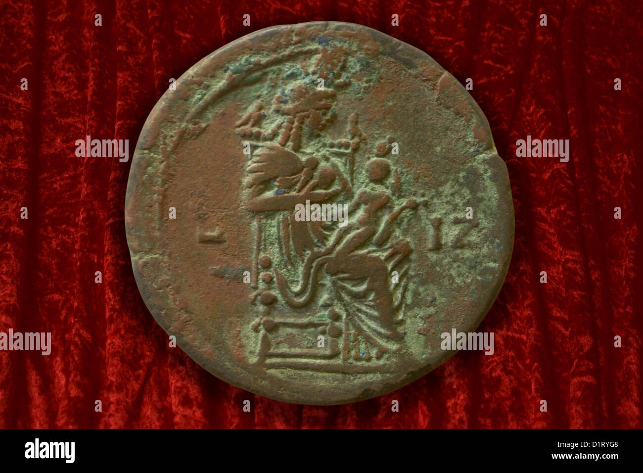 Bronze coin with Isis and her son Harpokrates Stock Photo
