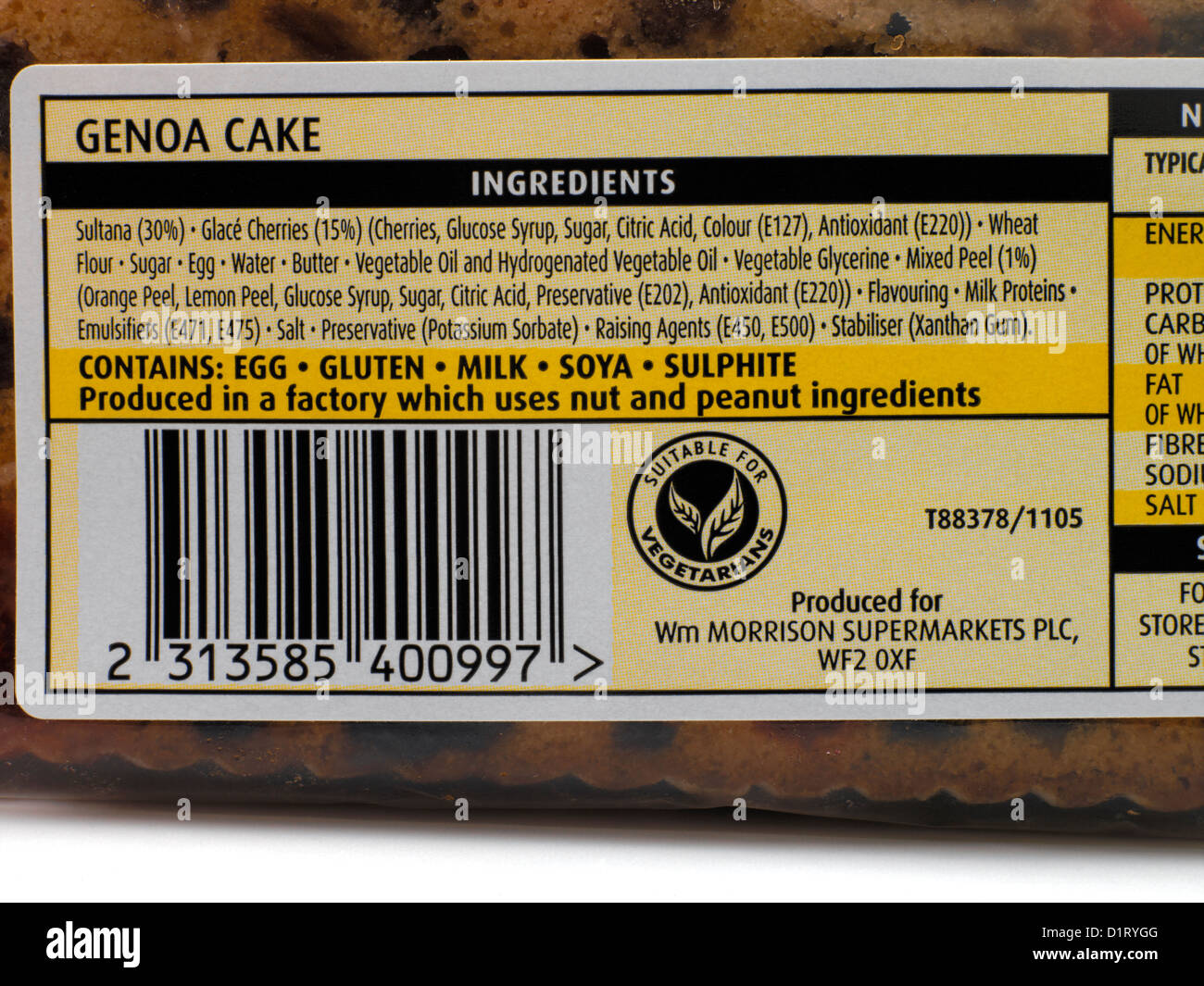 Nut Warning Label Produced in a Factory Which Uses Nut and Peanut Ingredients on Genoa Cake Stock Photo