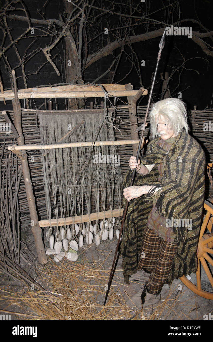 Iron Age Man With Spear Standing Beside Weaving Loom Stock Photo Alamy