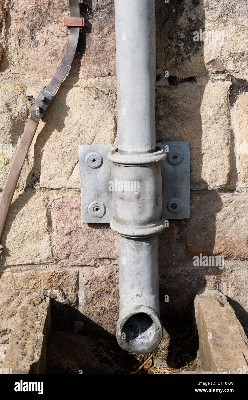 Lead downspout on side of Bolton Abbey, an historic building in the Yorkshire Dales Stock Photo