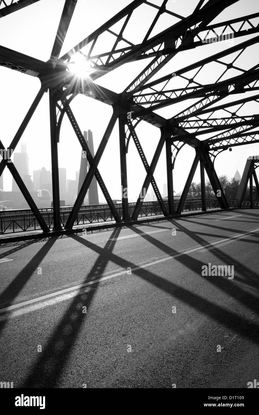 A morning view across the Waibaidu Bridge of Shanghai City across the Huangpu River. One of the earliest steel bridge built. Stock Photo