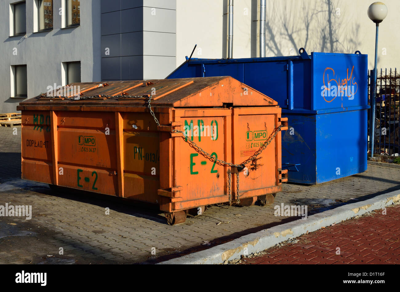 Two garbage, trash containers on the ground in Poland Stock Photo Alamy