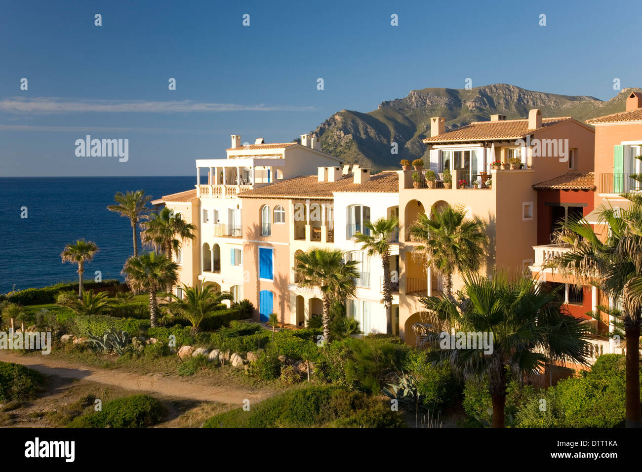 Colònia de Sant Pere, Mallorca, Balearic Islands, Spain. Luxury seafront apartment complex overlooking the Mediterranean. Stock Photo