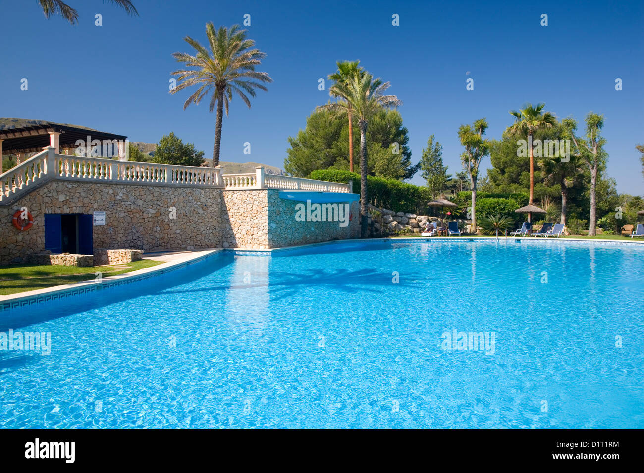 Colònia de Sant Pere, Mallorca, Balearic Islands, Spain. View across swimming pool of luxury apartment complex. Stock Photo