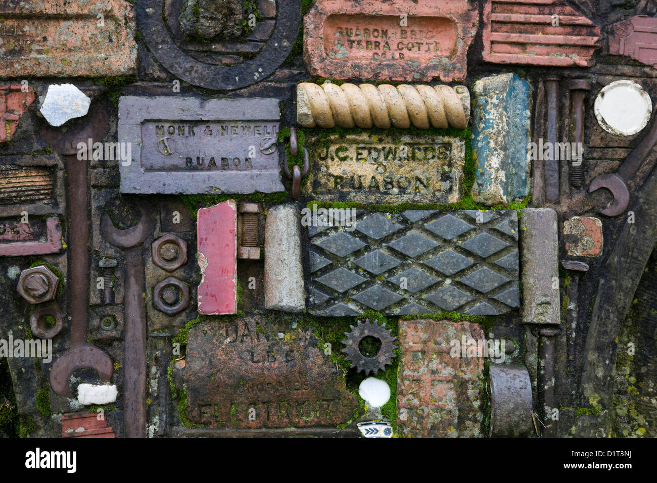 Artwork made of decorative bricks, spanners, nuts and bolts and gear wheels Stock Photo