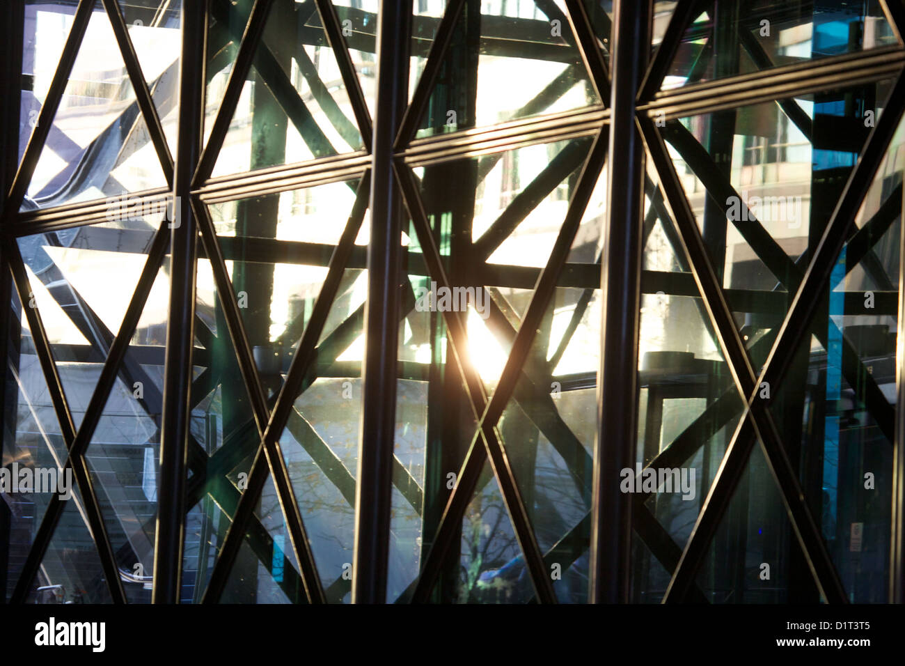 metal and glass windows with sunshine reflected in city building Stock Photo
