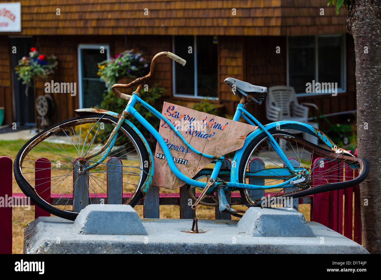 Bicycle rental advertised with a bent bike Stock Photo