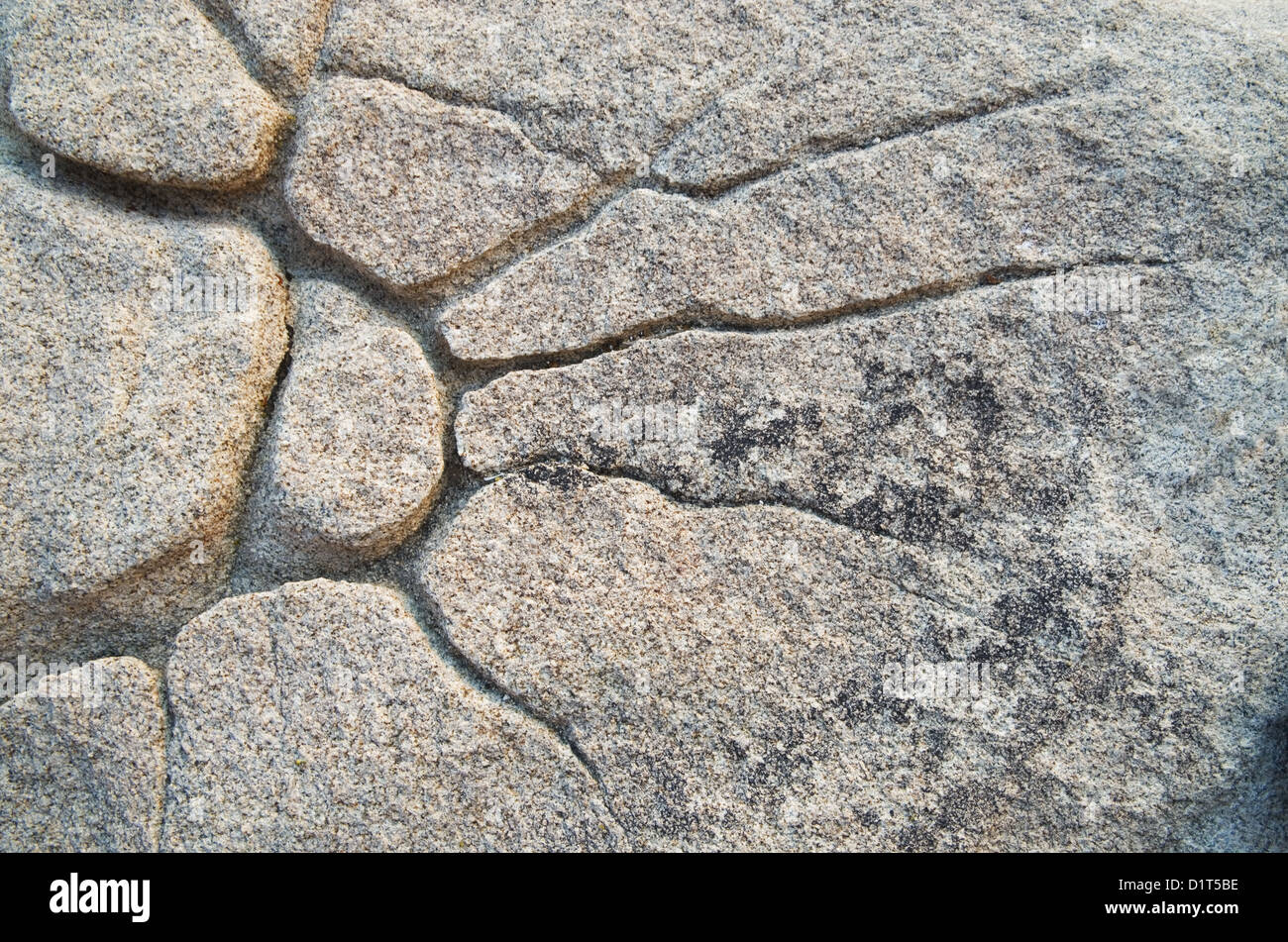 natural sunburst pattern eroded in granite rock Stock Photo