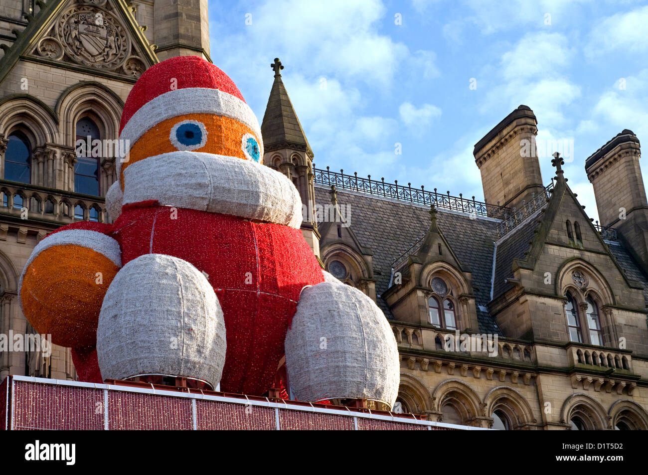 Giant Santa figure outside Manchester town hall in Albert Square, England, UK Stock Photo