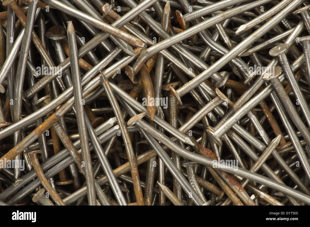 old rusty and bent nail close up background image Stock Photo