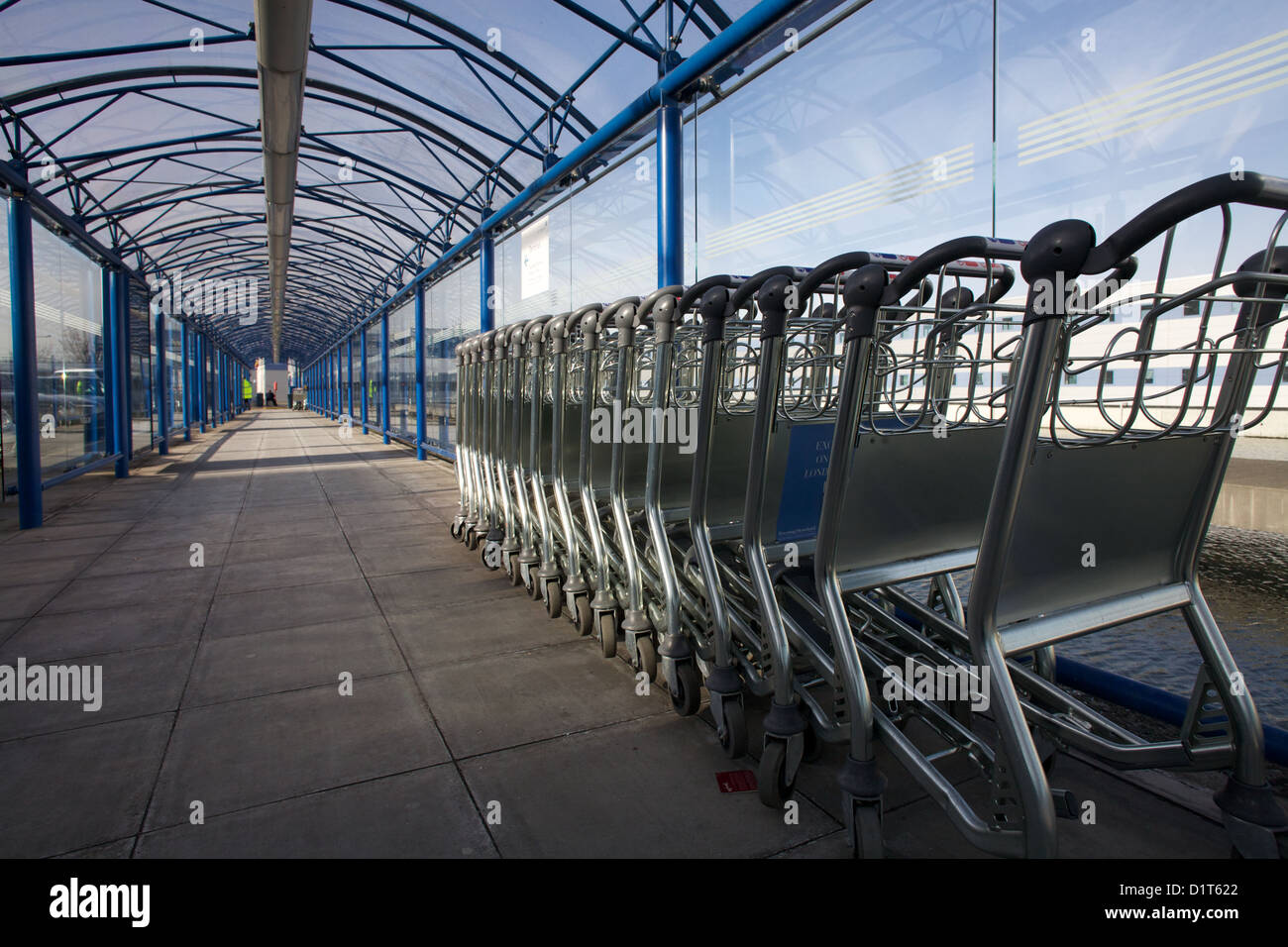Row of luggage trolleys at London City Airport Stock Photo