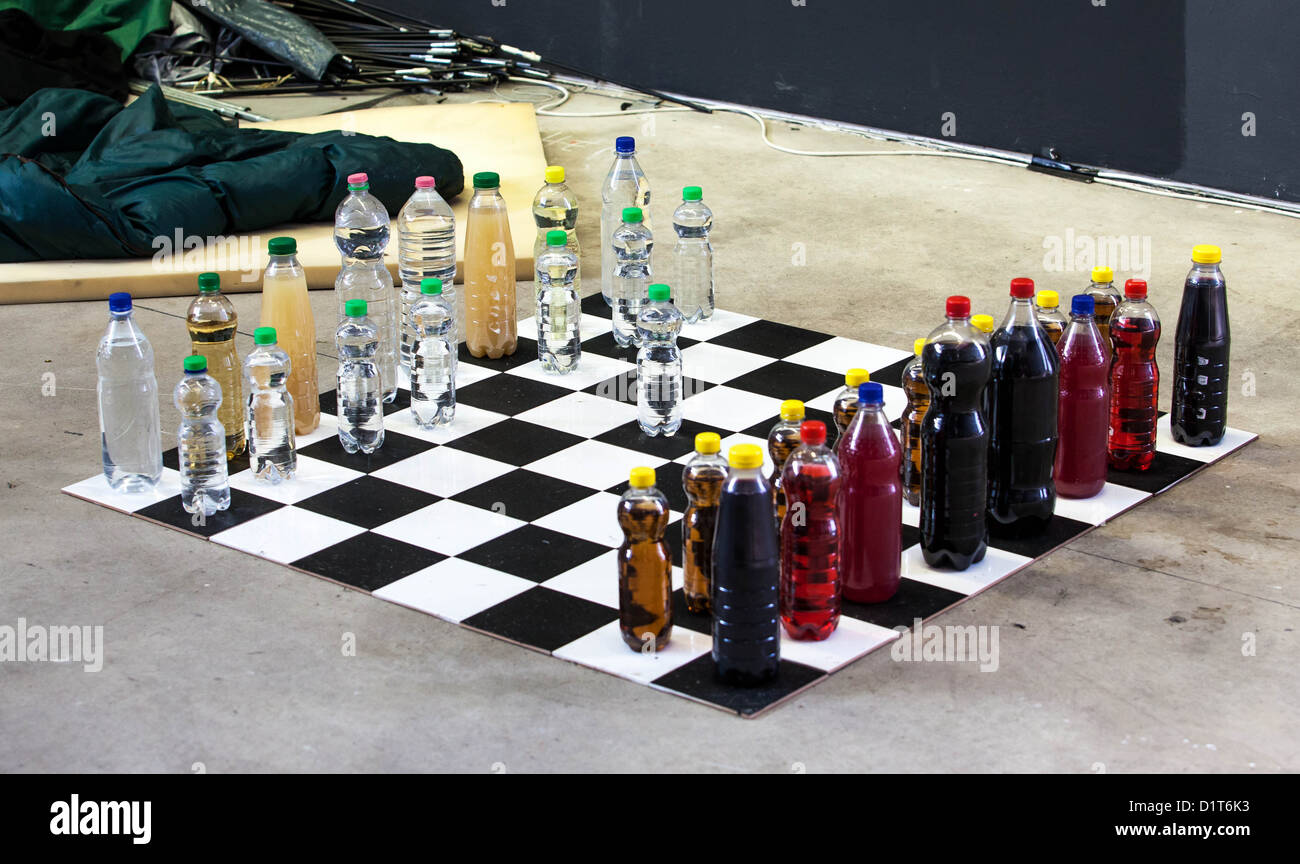 Improvised chess game for on the go. Chess field with bottles representing the figures Stock Photo
