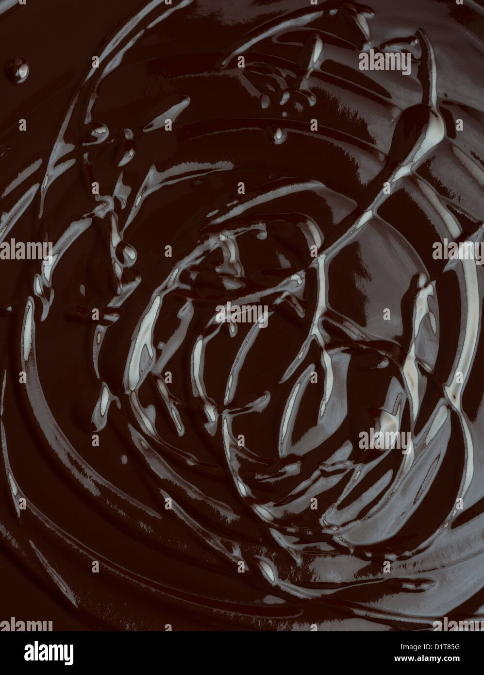 SWIRLS IN MELTED CHOCOLATE Stock Photo