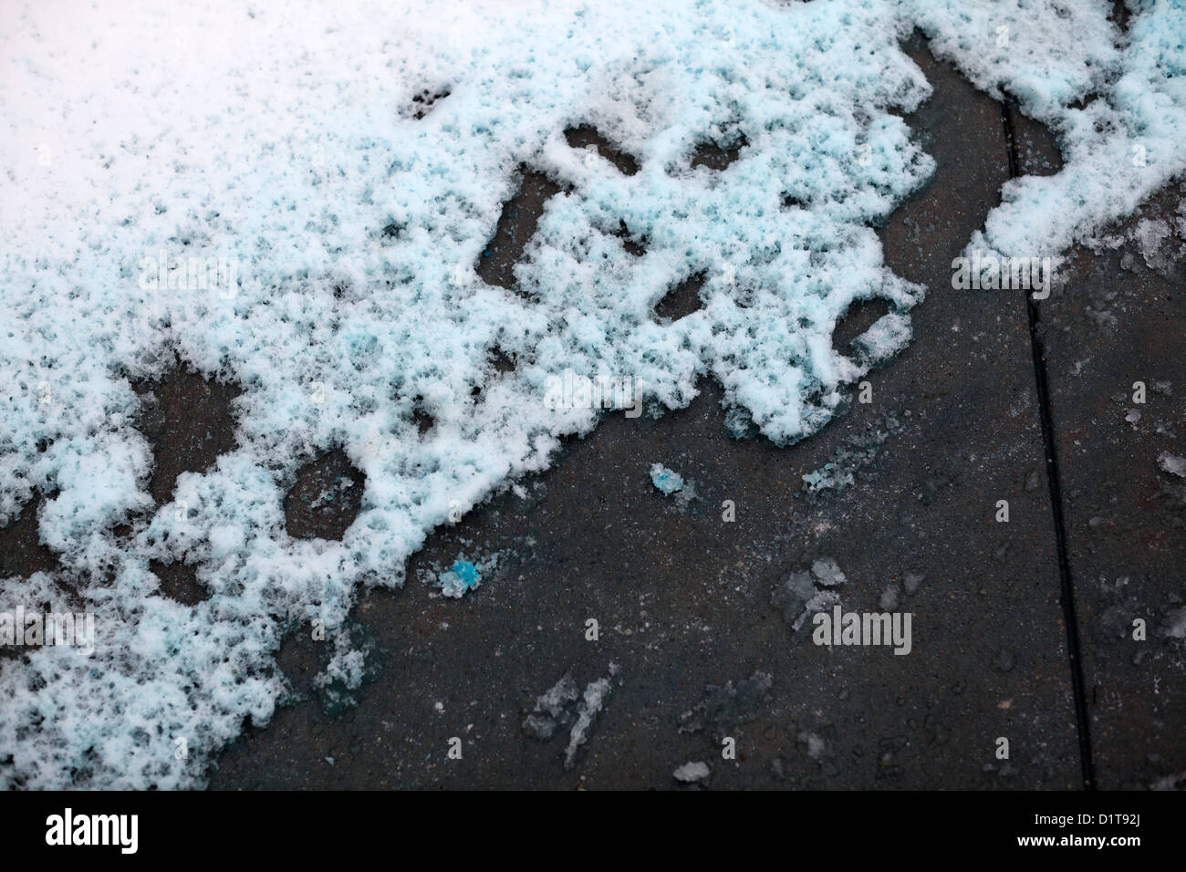 Bluetinted icemelt melting snow on pavement Stock Photo Alamy