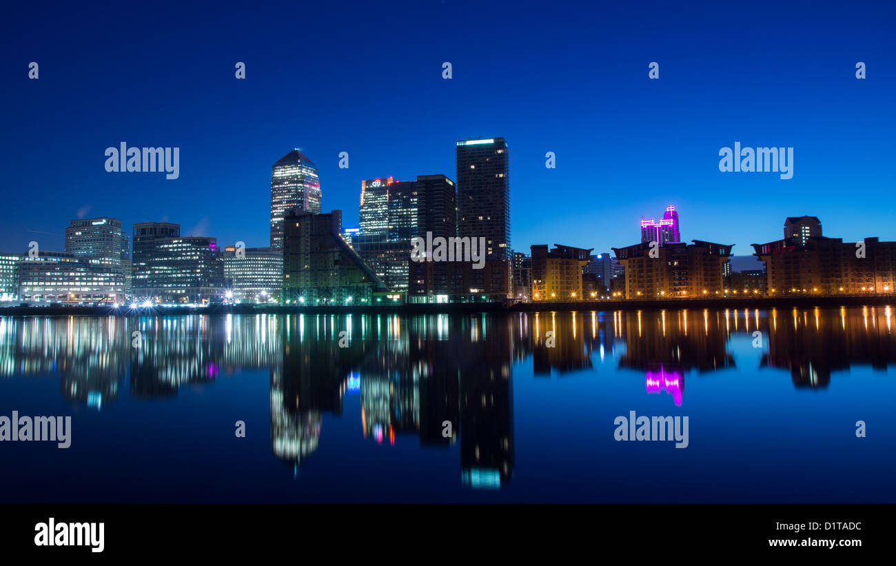 The Docklands development by night in london england Stock Photo