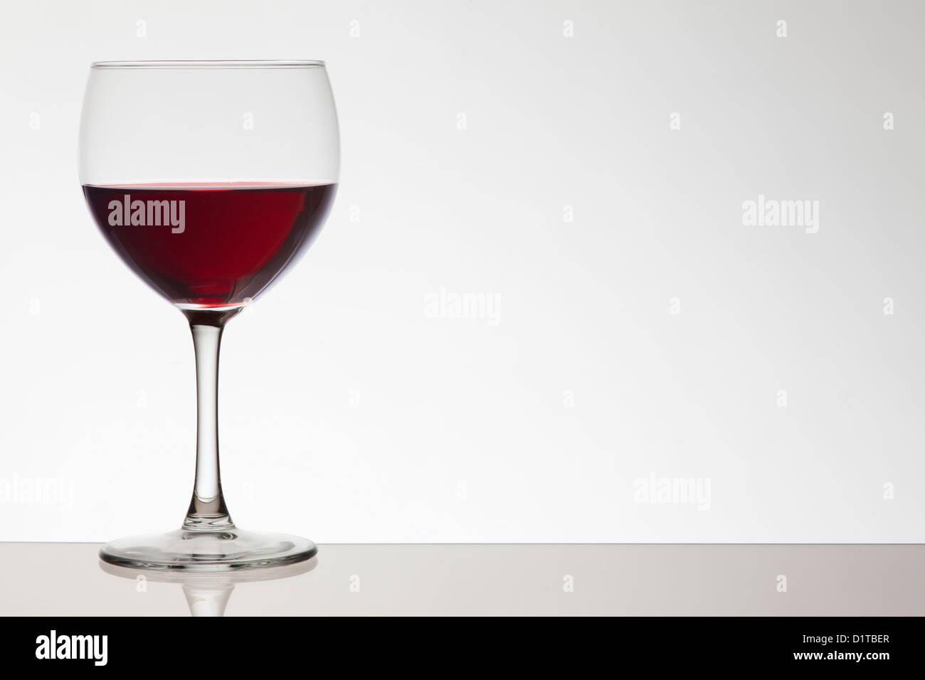 glass of red wine on white background Stock Photo