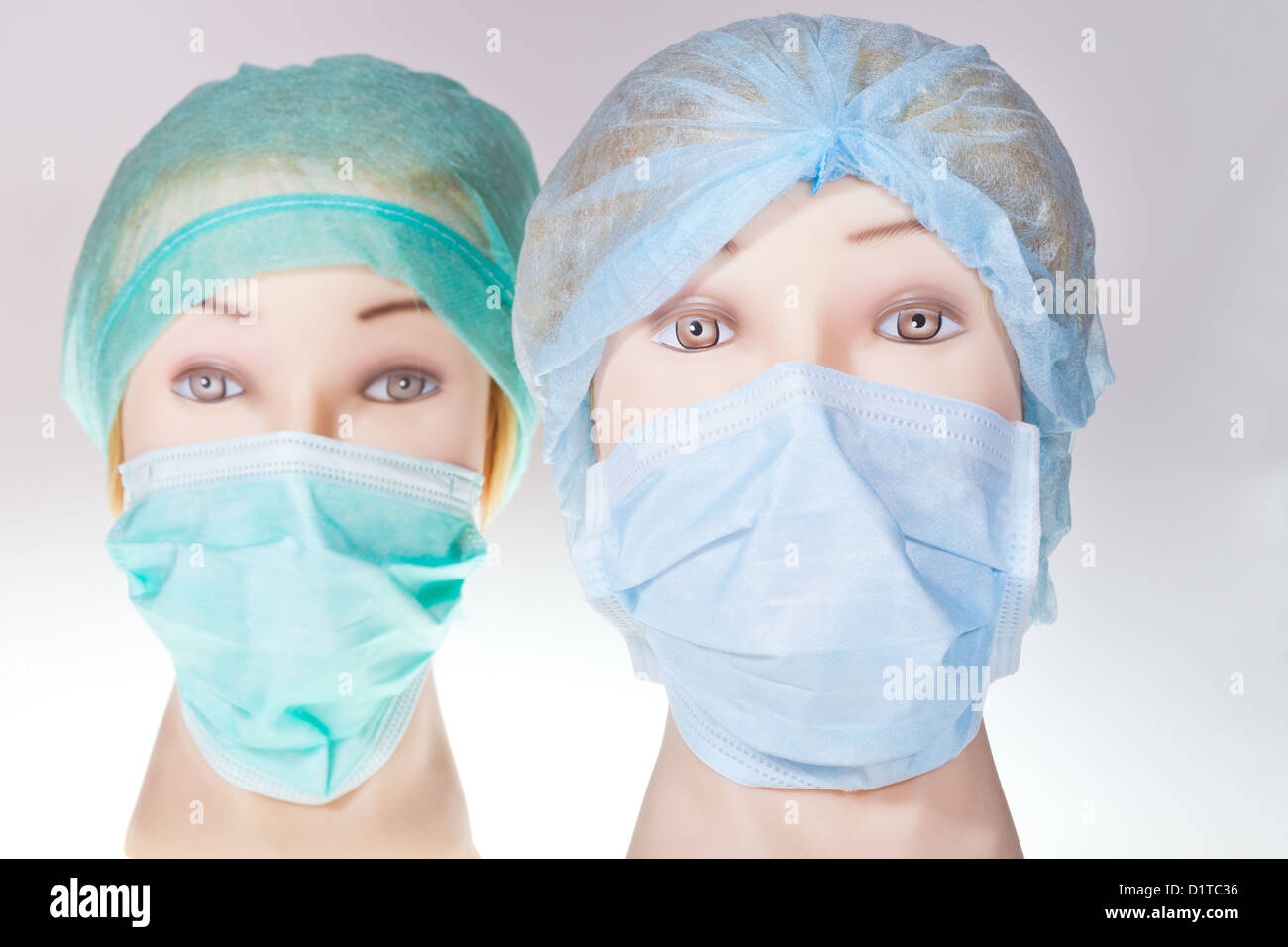 two women's manikin doctor heads wearing textile surgical cap and