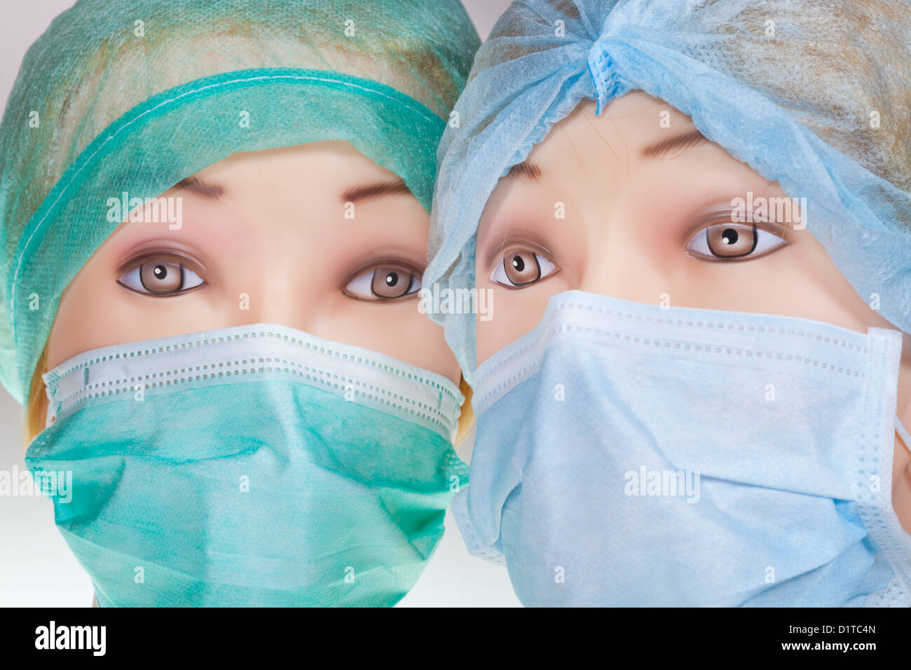 two female mannequin doctor heads wearing textile surgical cap and