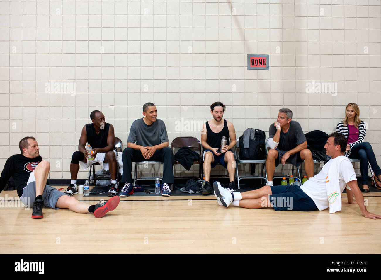 US President Barack Obama rests after an early morning basketball game with actors Don Cheadle, Tobey Maguire, and George Clooney May 11, 2012 in Los Angeles, CA. Stock Photo