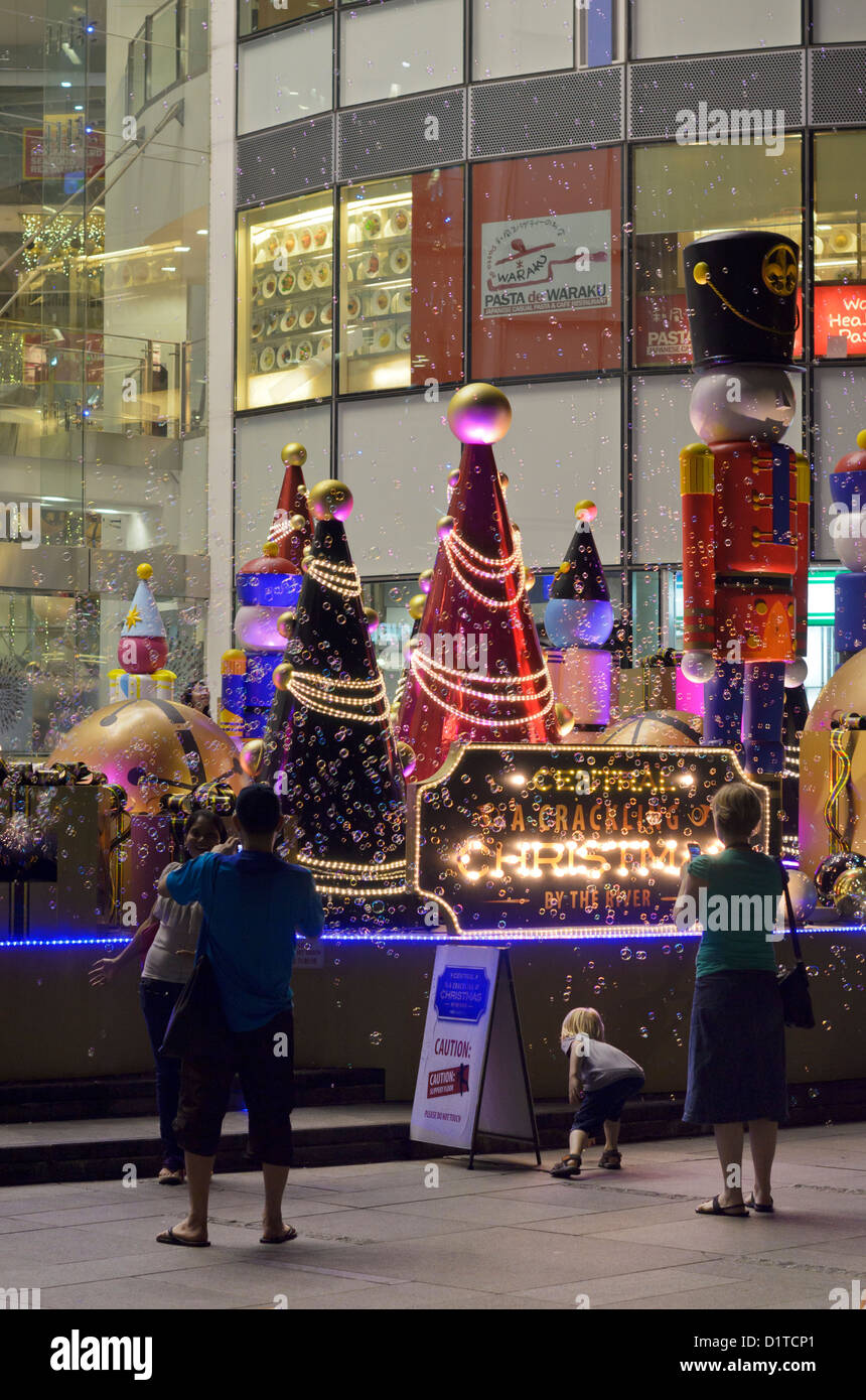 A Christmas bubble making machine along Clarke Quay in Singapore Stock