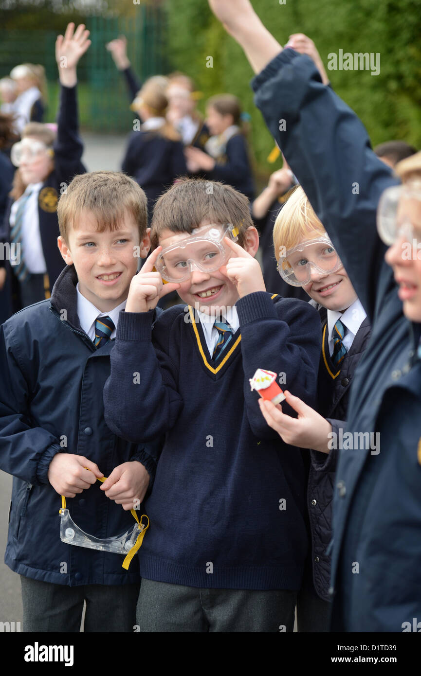 School boys with safety goggles during an outdoor rocket launch science lesson at Our Lady & St. Werburgh's Catholic Primary Sch Stock Photo