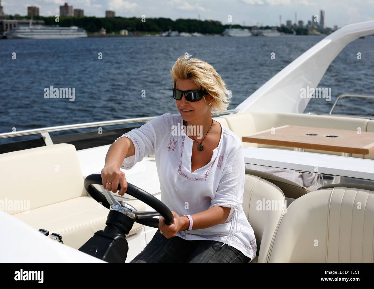 Woman behind wheel of boat hi-res stock photography and images - Alamy
