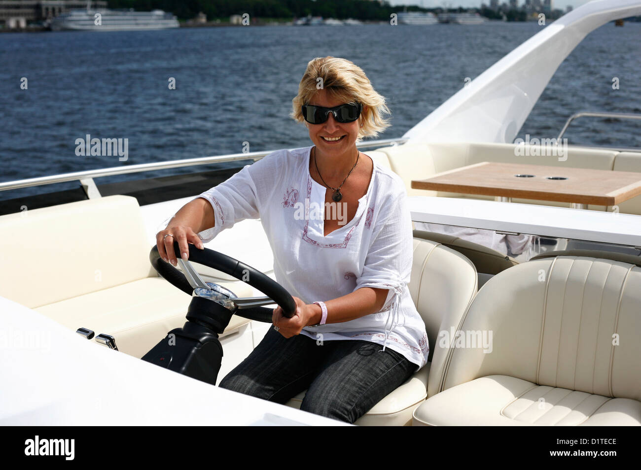 Woman behind wheel of boat hi-res stock photography and images - Alamy