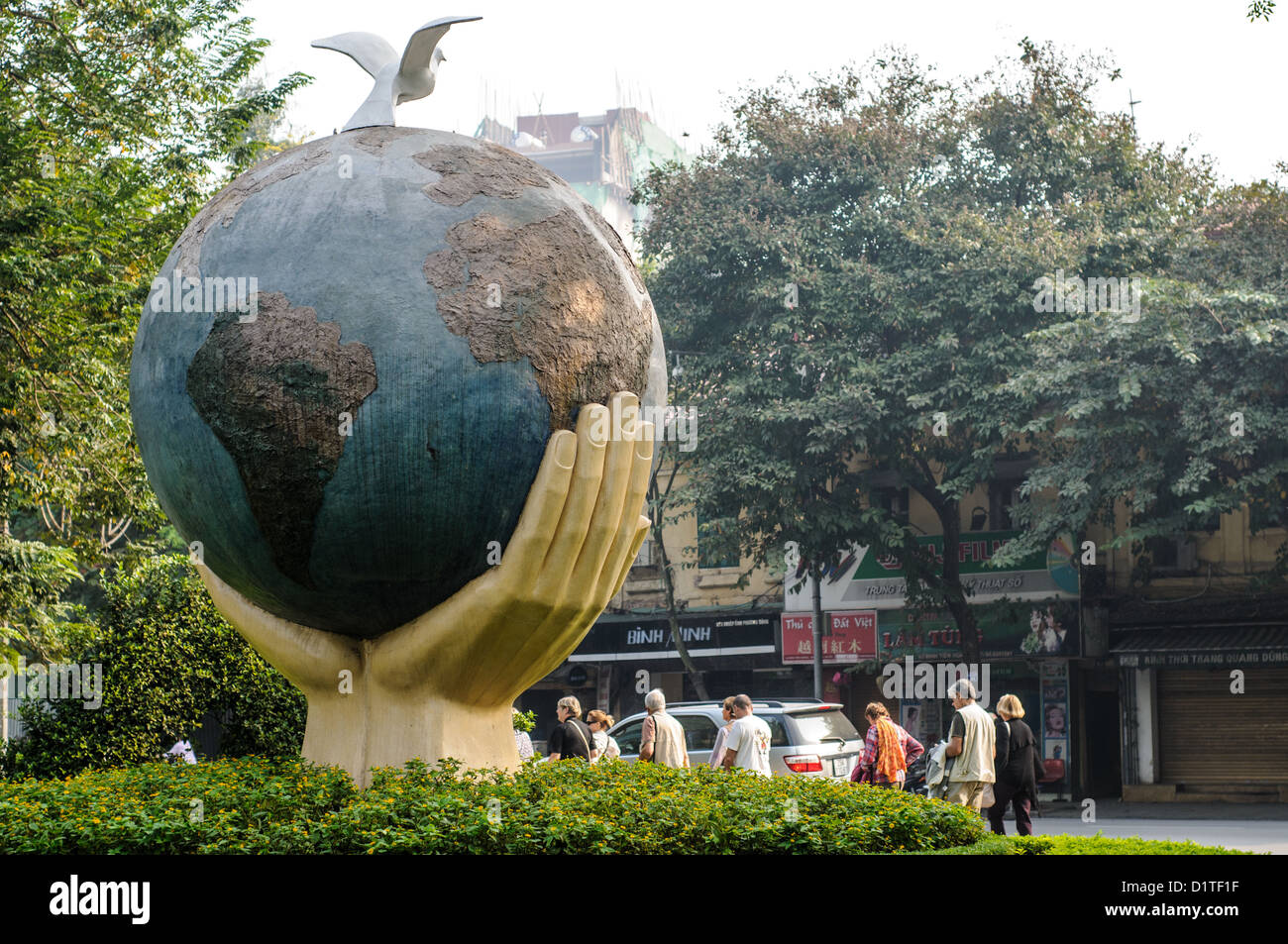 HANOI, Vietnam — An art sculpture of a globe with hands and a dove on