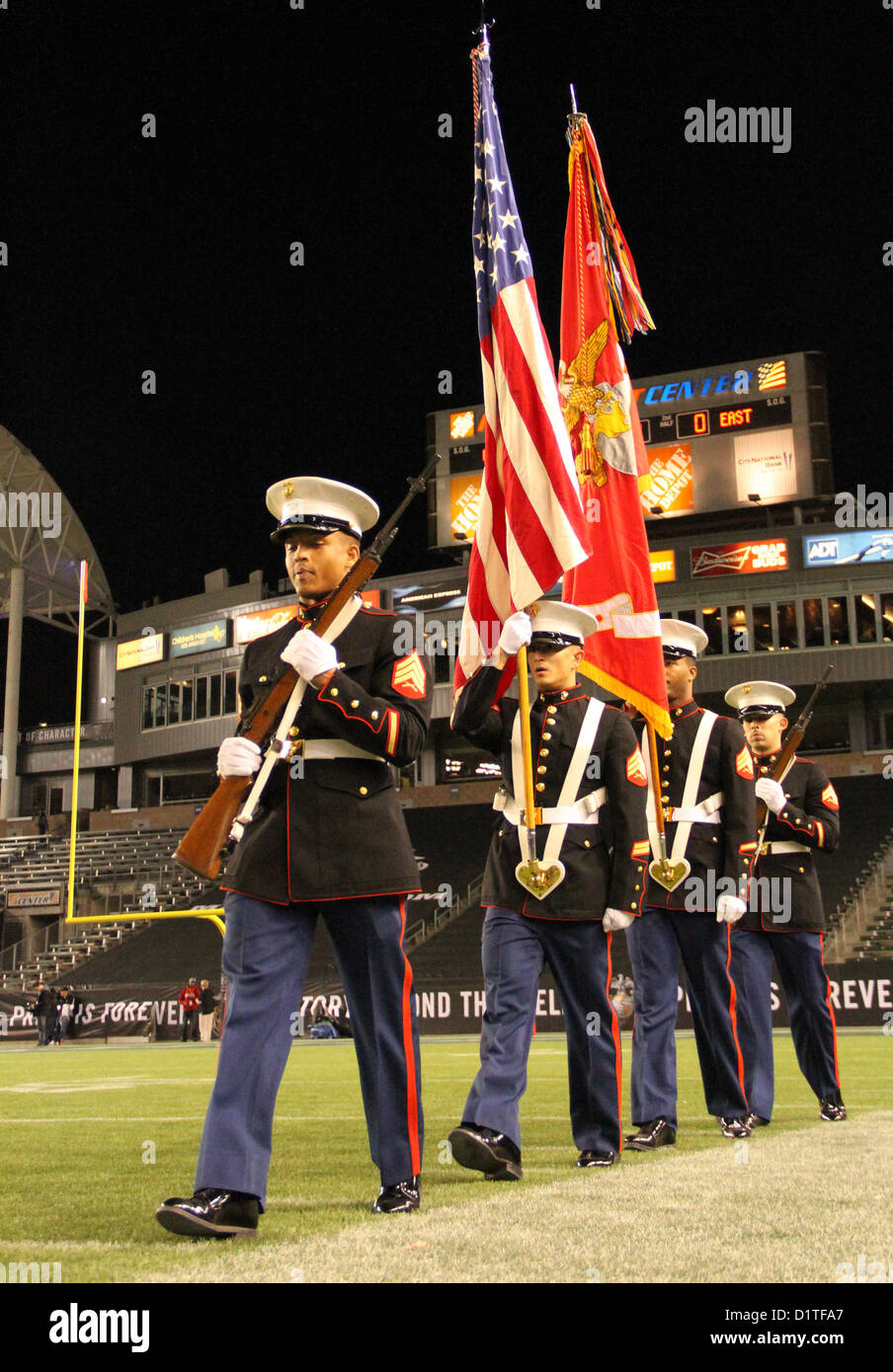 The 12th Marine Corps District color guard marches onto the field to prepare for the presentation of the United States and Marine Corps flag during the Semper Fidelis All-American Bowl, Jan. 4, 2013 at the Home Depot Center, Carson, Calif. The Semper Fidelis All-American Bowl is the culmination of the Marine Corps Semper Fidelis' Football Program, through which the Marine Corps purposefully engages with well-rounded student athletes to share leadership lessons that will enable future successes in their academic and athletic careers. (U.S. Marine Corps photo by Cpl. Jen S. Martinez)  (U.S. Mari Stock Photo