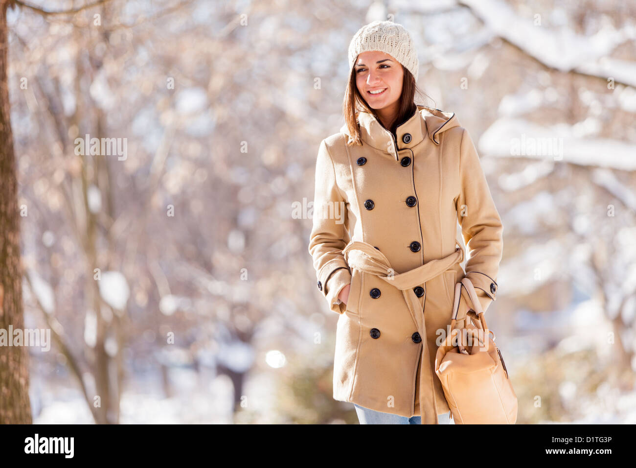 Young woman in the park at winter Stock Photo - Alamy