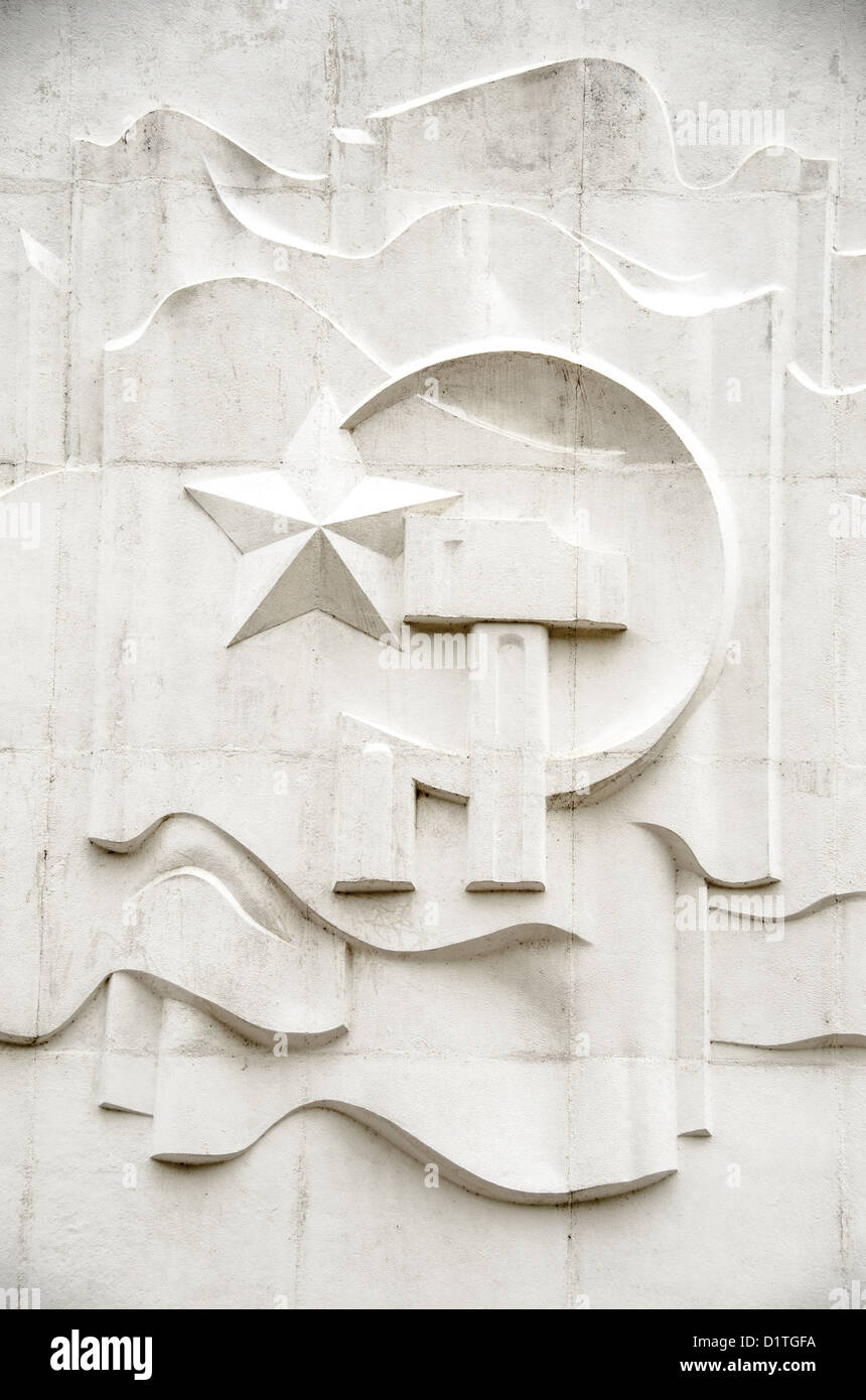 HANOI, Vietnam - The communist symbol of a hammer and sickle etched into the wall above the main entrance of the Ho Chi Minh, or Uncle Ho, the former leader of North Vietnam and founder of modern unified Vietnam. Stock Photo